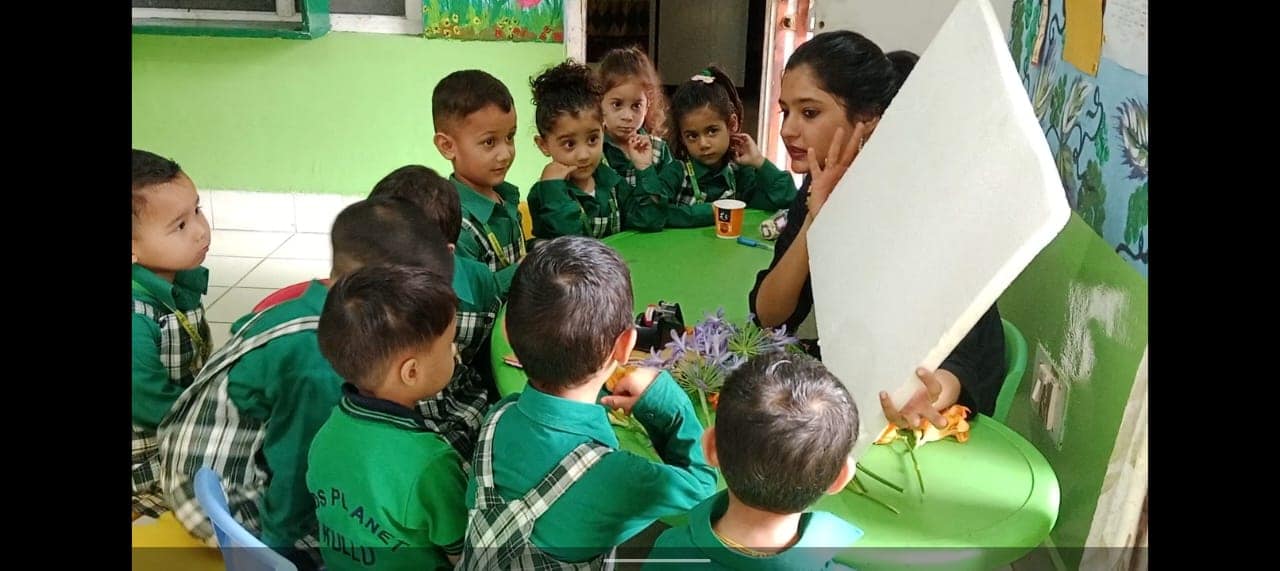 Teacher reading a story to preschool children